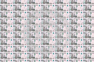 1000 russian rubles bills printed in money production conveyor. Collage of many bills. Concept of currency devaluation