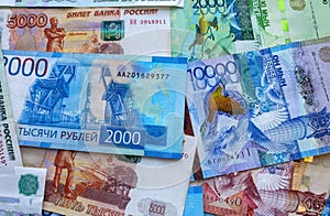 Russian rubles and Kazakhstan national currency, top view of mixed tenge and roubles banknotes