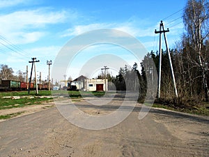 Russian rural landscape with empty countryside dirt wet road