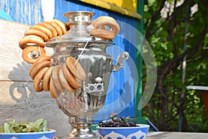 Russian samovar and a lot of bagels. Bright summer day