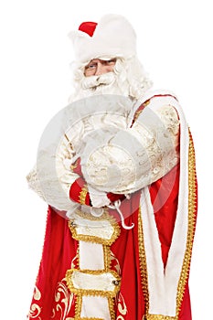 Russian Santa Claus with a beard in a red coat and hat. Celebrating New Year and Christmas. Isolated on white background. Vertical