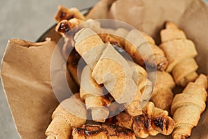 Russian slavic traditional pastry called roguelikes. Cakes bagels. Crispy croissants. Food on grey background, Closeup view