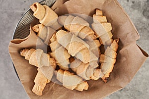 Russian slavic traditional pastry called roguelikes. Cakes bagels. Crispy croissants. Food on grey background, Closeup view