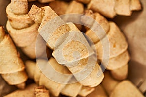 Russian slavic traditional pastry called roguelikes. Cakes bagels. Crispy croissants. Food on grey background, Closeup view