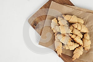 Russian slavic traditional pastry called roguelikes. Cakes bagels. Crispy croissants. Food on white background, Copy space
