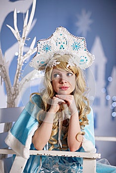 Russian Snow Maiden in blue suit and kokoshnik