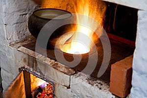 Russian stove and old cast-iron pot