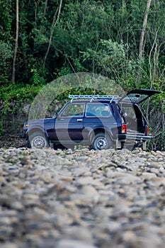 Russian SUV Lada Niva 4x4 on the riverside