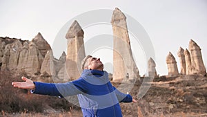 Russian tourist energized in the Valley of Love in Goreme Cappadocia Turkey during the freezing winter months.