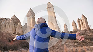 Russian tourist energized in the Valley of Love in Goreme Cappadocia Turkey during the freezing winter months.