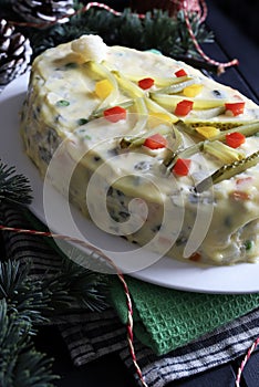 Russian traditional salad Olivier with vegetables, meat. Christmas season.