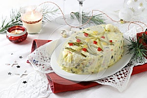 Russian traditional salad Olivier with vegetables, meat. Christmas season.