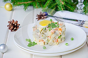 Russian traditional salad Olivier with vegetables and meat for New Year and Christmas.