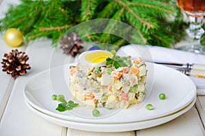 Russian traditional salad Olivier with vegetables and meat for New Year and Christmas.