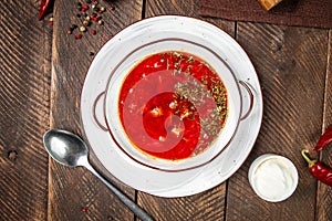 Russian traditional soup borsch on wooden table
