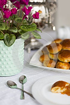 Russian traditional teaparty with samovar and pies or pirozhki with apple jam photo