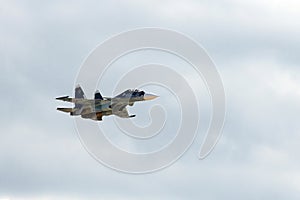 Russian two-seat twin-engine super maneuverable deck-mounted multi-purpose fighter Su-30 CM Flanker-C in the sky at the Internat photo