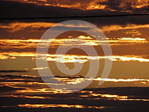 Sunset. parallel orange clouds.