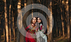 Russian village girls in headscarves in a forest
