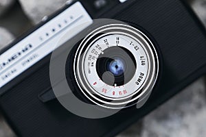 Russian vintage camera with stone texture background. Black and white photography camera.