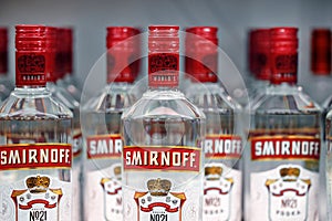 Russian vodka. Bottles of Smirnoff vodka on a shelf in duty free shop in Dubai Airport. Traditional Russian souvenir. 12