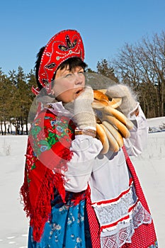 Russian woman in sundress eating donut