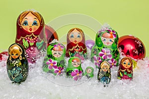 Russian wooden dolls with snow and Christmas balls