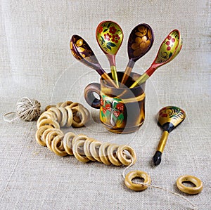 Russian wooden painted tableware: spoons in a mug