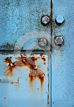 Rust on blue metal panels