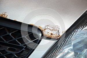 Rust on the bonnet of a silver car