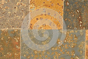 Rust colored square flagstones wall photo