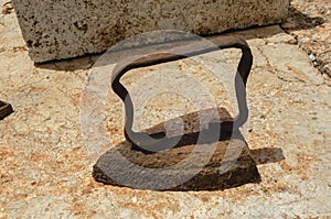 Rusty Clothes Iron on Concrete Surface