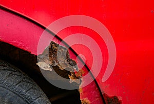 Rust detail on old abandoned red car