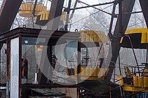 Rust  ferris wheel attraction in fog