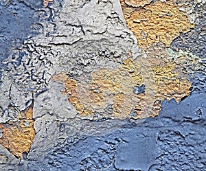 Rust on the iron. The textures and background of cracked blue and yellow paint on the metal