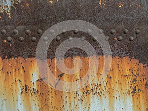 Rust metal texture with riveting, abstract grunge background