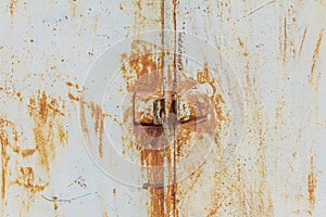 Rust.Old rusty metal door with holes for a padlock