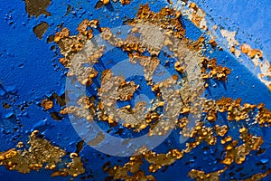 Rust spots on a blue ship\'s hull