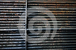 Rust steel tubes of the heat exchanger for maintenance, the water heater in the boiler as background