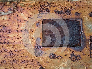 Rust texture with metal window, abstract grunge background
