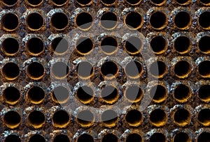 Rust tube sheet of the heat exchanger for maintenance in fabrication, the water heater in the boiler as background