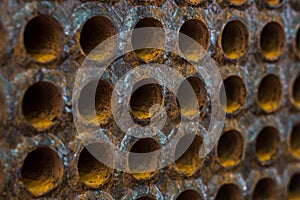 Rust tube sheet of the heat exchanger for maintenance in fabrication, the water heater in the boiler as background