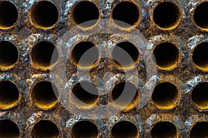 Rust tube sheet of the heat exchanger for maintenance in fabrication, the water heater in the boiler as background