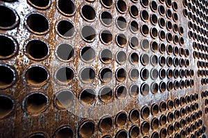 Rust tube sheet of the heat exchanger for maintenance, the water heater in the boiler as background