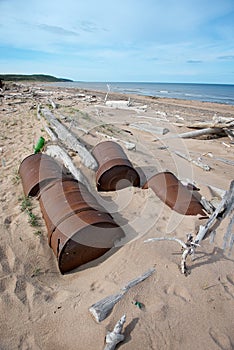 Rusted barrels on the shore, Chukotka.