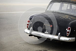 Rusted black automobile from b