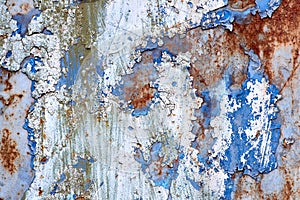 Rusted blue and white painted wall. Corroded metal background