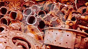 The rusted car components in garbage