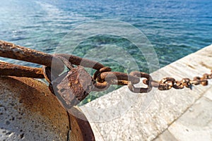 A rusted chain and an old rusty lock