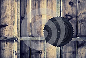 Rusted Circular Saw Blades on a Wooden Wall - Retro